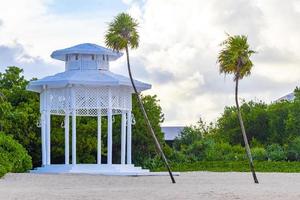 White noble pergula pavilion in paradise on beach palms Mexico. photo