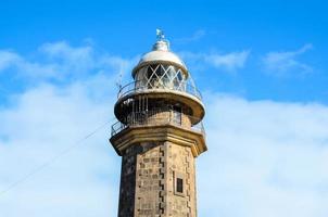 Lighthouse by the sea photo