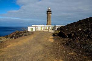 Lighthouse by the sea photo