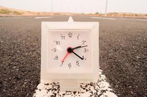 Clock on the road photo