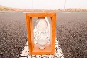 Hourglass on the road photo