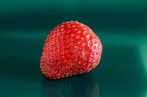 Strawberry on green background photo