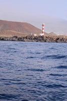 Lighthouse by the sea photo