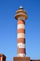 Lighthouse by the sea photo