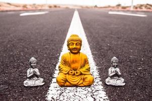 Buddha statues on the road photo