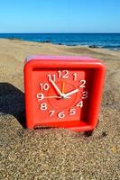 Clock on the beach photo