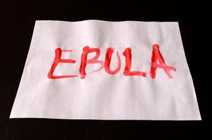 Ebola sign on black background photo