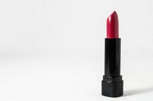Red lipstick on white background photo