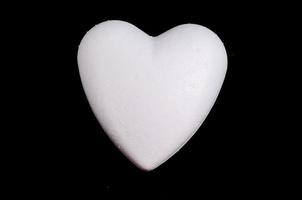 White heart on black background photo