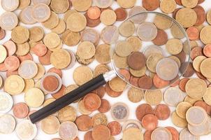 Magnifying glass on coins photo