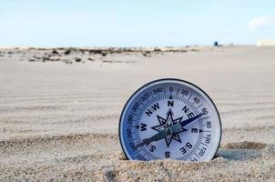 Compass in the sand photo