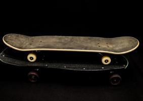 Skateboard on black background photo