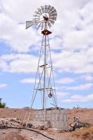 Traditional windmill under clear blue sky photo