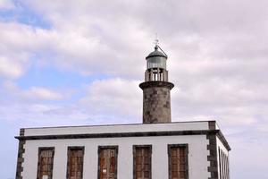 Lighthouse by the sea photo