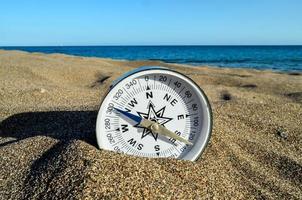 Compass in the sand photo