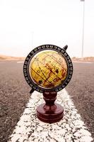 Globe on the road photo