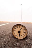 Clock on the road photo