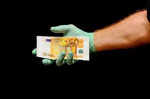 Hand holding Euro banknotes photo