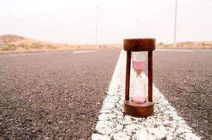 Hourglass on the road photo