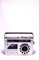 Old casette player and radio on white background photo