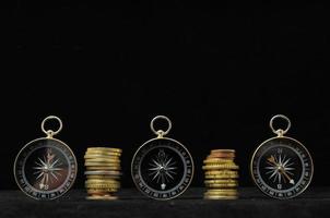 Compasses and coins photo