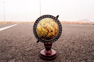 Globe on the road photo