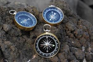 Compasses on a rock photo