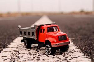 Toy truck on the road photo