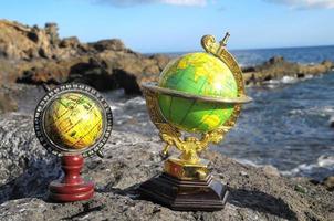 Globes on a rock photo