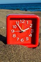 Clock on the beach photo