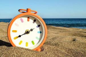 Clock on the beach photo