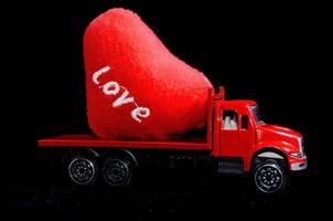 Toy truck carrying a heart photo