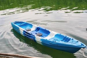Kayak boat flowing on the beautiful river in vacation time photo