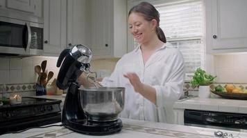 Woman Setting up an Electric Mixer video