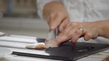 Woman Cutting Chicken Breast video