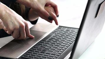 Mother and her son working up on laptop.European people.Hands close up. video