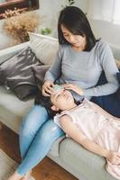 Asain Mother taking care for sick daughter