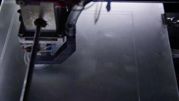3D printer in process printing an object. video
