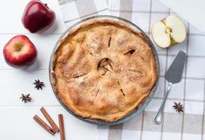 Homemade apple pie with fresh red apples photo