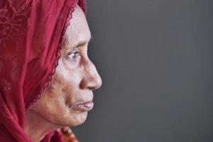 side view of thoughtful senior asian women face photo