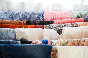 child clothes line filled with hanging trousers photo