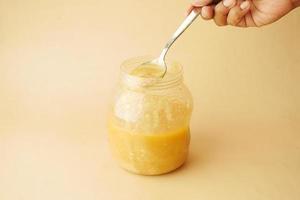 homemade ghee in container on a table , photo