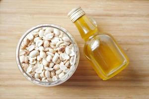 overhead shot view peanuts and oils in a container photo