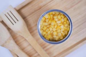 preserved sweet corm in a tin container on table photo