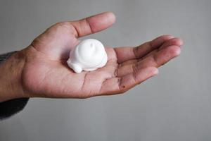 top view of shaving foam on hand photo