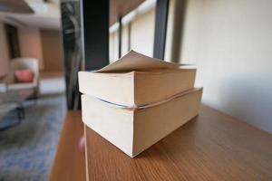 stack of books in a shelf photo