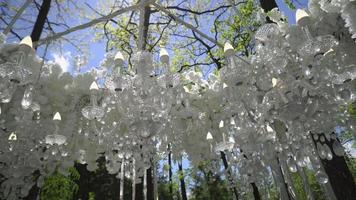 White wedding arch with chandeliers and candles video