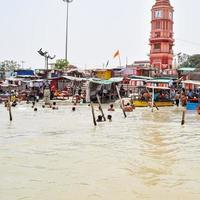 Garh Mukteshwar, Uttar Pradesh, India - June 11 2022 - People are taking holy dip on the occasion of Nirjala Ekadashi, A view of Garh Ganga Brij ghat which is very famous religious place for Hindus photo