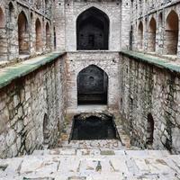 Agrasen Ki Baoli Step Well situated in the middle of Connaught placed New Delhi India, Old Ancient archaeology Construction photo
