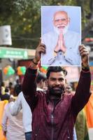 New Delhi, India - January 16 2023 - Thousands of people collected during Prime Minister Narendra Modi BJP road show, people during PM Modi big election rally in the capital photo